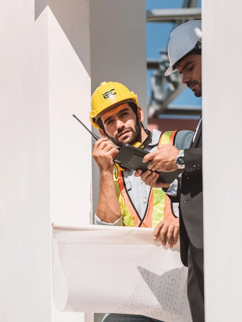 Site engineer reviewing drawings on a construction site