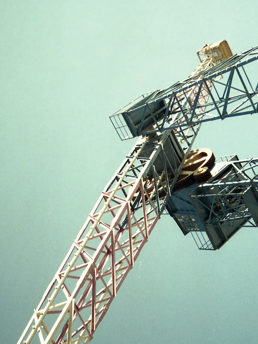 Crane boom against a pale sky